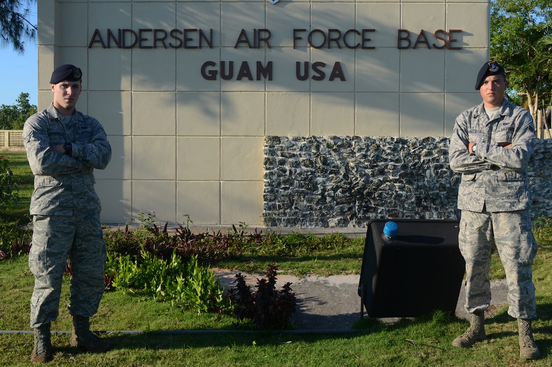 U.S. Air Force Airmen 1st Class Colby (left) and Travis Wakefield, 36th Security Forces Squadron entry controllers, stand at the entry to Andersen Air Force Base, Guam, July 29, 2015. While they are brothers in arms who serve together, they are also fraternal twins who have worked together since entering the Air Force in October 2013. (U.S. Air Force photo by Airman 1st Class Alexa Ann Henderson/Released)