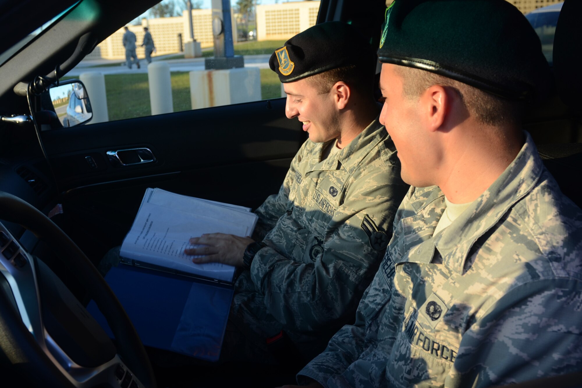 U.S. Air Force Airmen 1st Class Travis (left) and Colby Wakefield, 36th Security Forces Squadron entry controllers, prepare for a shift together July 29, 2015, at Andersen Air Force Base, Guam. While they are brothers in arms who serve together, they are also fraternal twins who have worked together since entering the Air Force in October 2013. (U.S. Air Force photo by Airman 1st Class Alexa Ann Henderson/Released)