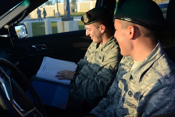 Airmen 1st Class Travis and Colby Wakefield, both are 36th Security Forces Squadron entry controllers, prepare for a shift together July 29, 2015, at Andersen Air Force Base, Guam. While they are brothers in arms who serve together, they are also fraternal twins who have worked together since entering the Air Force in October 2013. (U.S. Air Force photo/Airman 1st Class Alexa Ann Henderson)