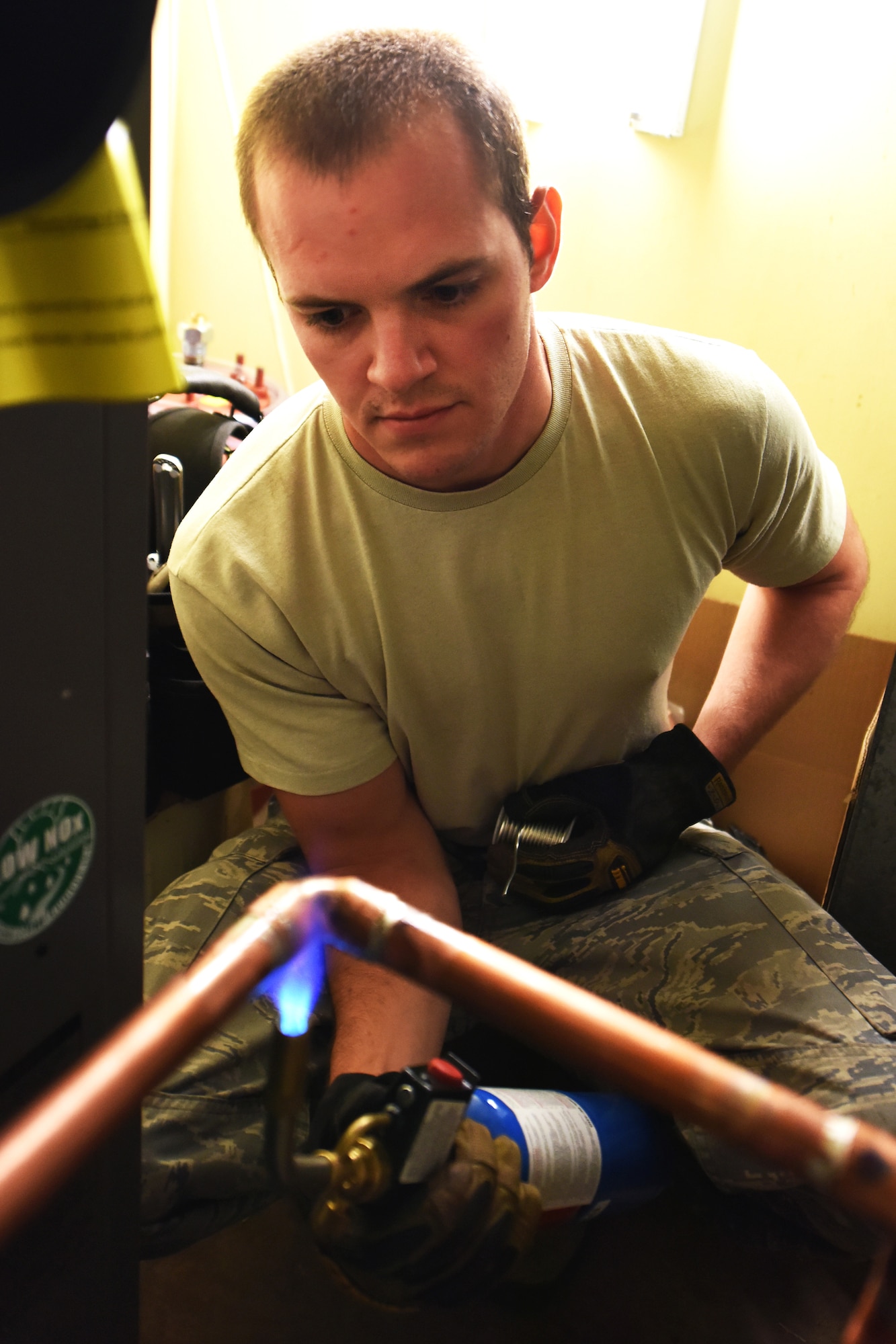 Senior Airman Julian Donahue, 341st Civil Engineer Squadron Heating Ventilation and Air Conditioning technician, soldered two pieces of copper using a turbo torch July 30, 2015, at Malmstrom Air Force Base, Mont. HVAC completed 102 job orders for the month of July. (U.S. Air Force photo/Chris Willis)