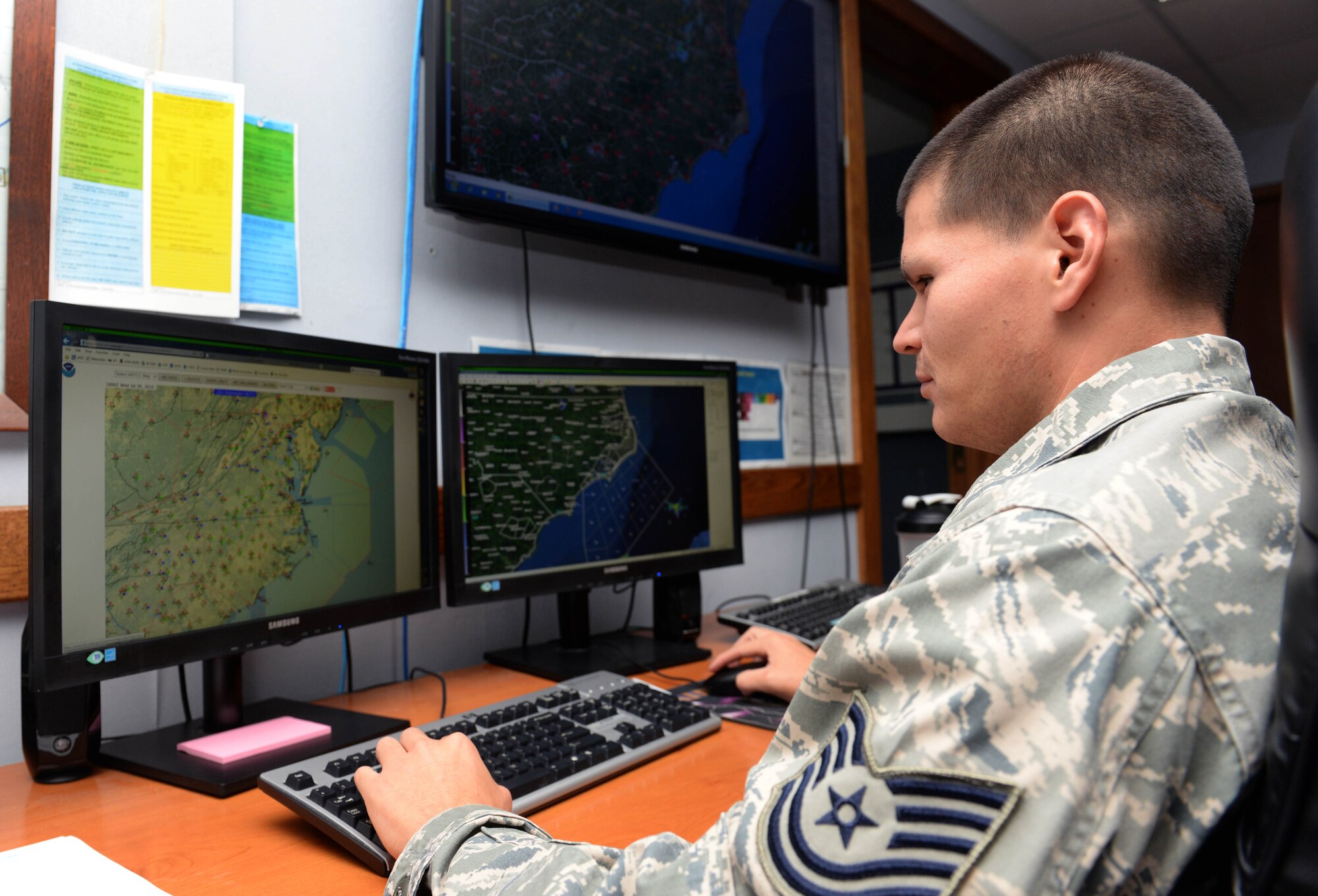 Tech. Sgt. Adam Dzurilla, 4th Operations Support Squadron weather forecaster, monitors data, July 29, 2015, at Seymour Johnson Air Force Base, North Carolina. Weather specialists predict patterns and prepare forecasts to advise leadership on factors that could affect the base’s mission. (U.S. Air Force photo/Senior Airman John Nieves Camacho)