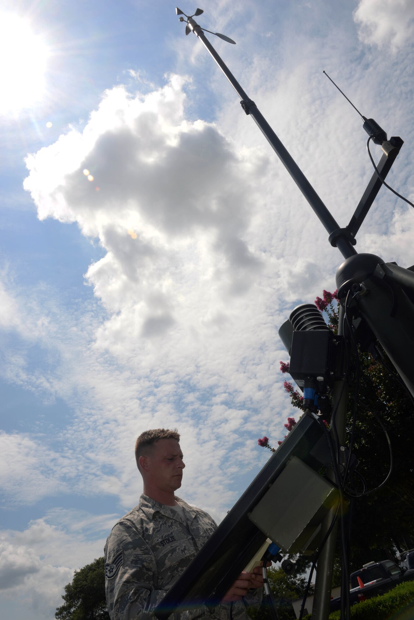 Staff Sgt. Steven Stolze, 4th Operations Support Squadron weather forecaster, operates a TMQ-53 tactical meteorological observing system, July 27, 2015, at Seymour Johnson Air Force Base, North Carolina. The tool assists weather forecasters by gathering atmospheric data such as temperature, cloud altitude and static discharge. (U.S. Air Force photo/Senior Airman John Nieves Camacho)