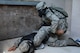 Members of the 125th Fighter Wing Security Forces Squadron conduct deployment training on July 24, 2015 at Camp Blanding Joint Training Center, Starke, Florida. Instructors from the Florida National Guard Counter Drug program helped train the Airmen in urban close quarters battle operations. (U.S. Air Force photo by MSgt Jaclyn Lyons)