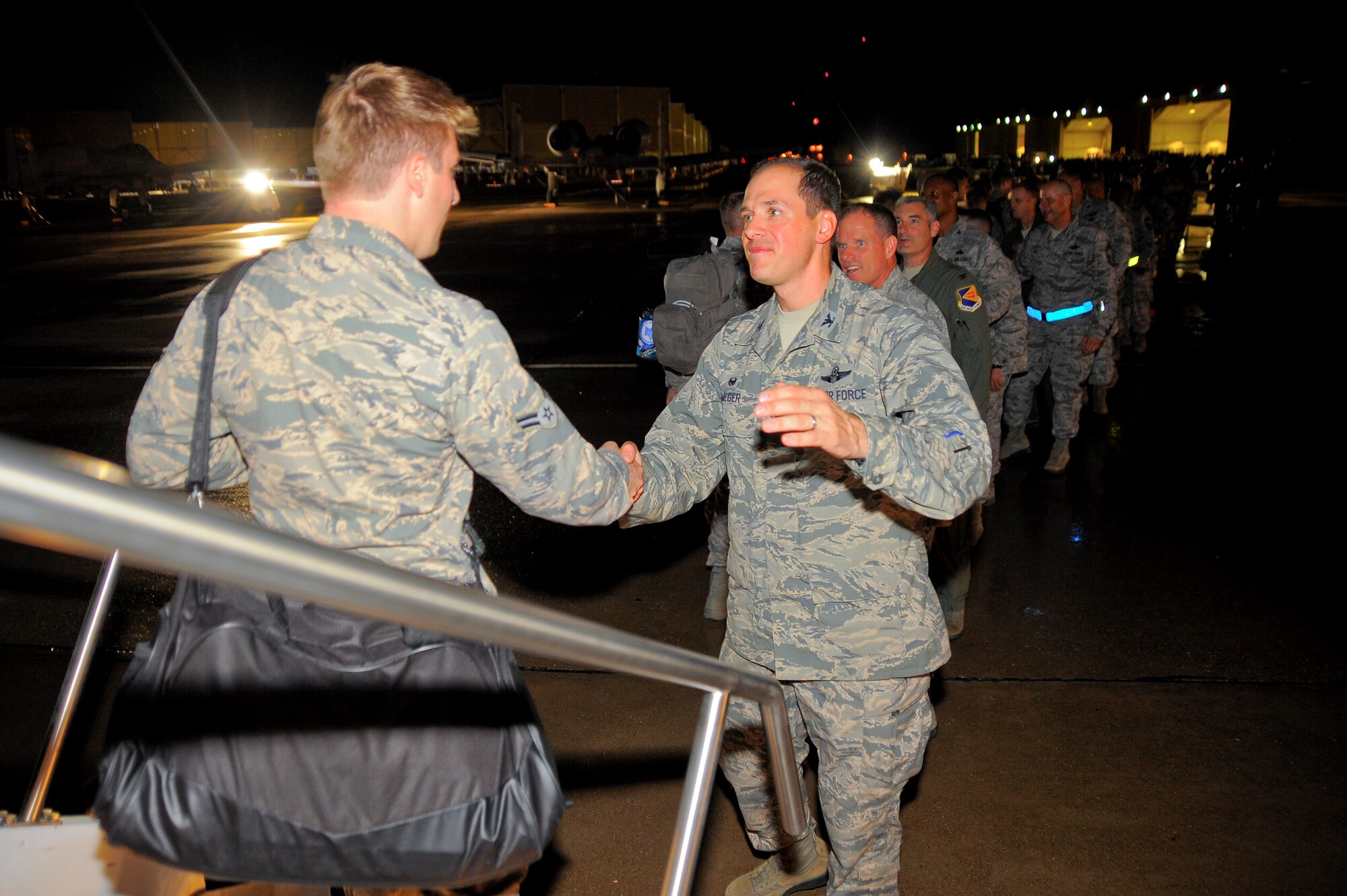 U.S. Air Force Col. James P. Meger, 355th Fighter Wing commander, leads the welcome line of the 355th Fighter Wing leaders at Davis-Monthan Air Force Base, Ariz., July 29, 2015, greeting more than 200 Airmen as they return home from six month deployment to Europe.  The Airmen were deployed in support of the first European Theater Security Package in support of Operation Atlantic Resolve. (U.S. Air Force photo by Staff Sgt. Angela Ruiz/Released)