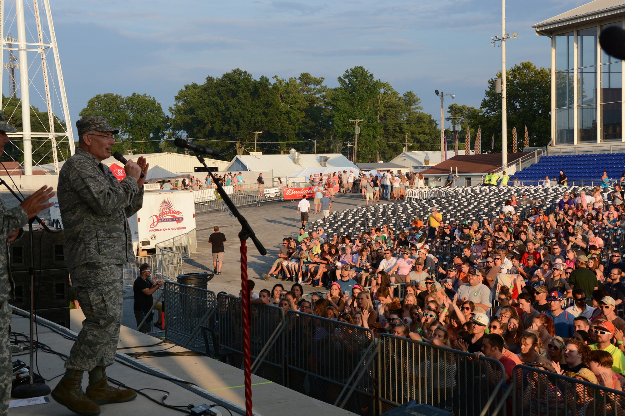 Col Jonathan M. Philebaum, 512th Operations Group commander, addresses the crowd during Armed Forces Day at the Delaware State Fair, Harrington, Del., July 29, 2015. As part of Armed Forces Day, the fair recognizes veterans, service members and their families while offering free admission. (U.S. Air Force photo/Tech. Sgt. Mercedes Crossland)