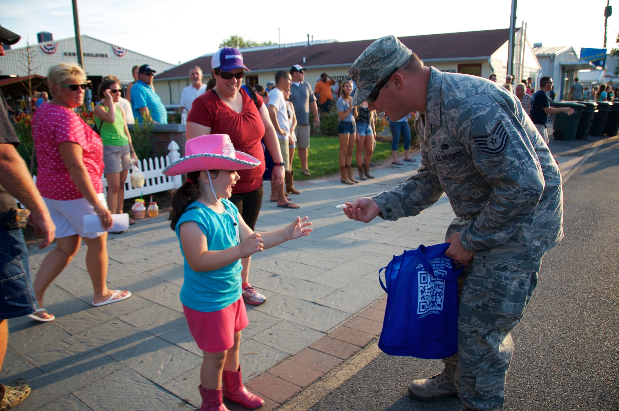Reserve Airman from the 512th Airlift Wing join Team Dover for an Armed Forces Day parade at the Delaware State Fair, Harrington, Del., on Jul. 30, 2015. As part of Armed Forces Day, the fair recognizes veterans, service members and their families while offering free admission. (U.S. Air Force photo/2nd Lt Steve Lewis)