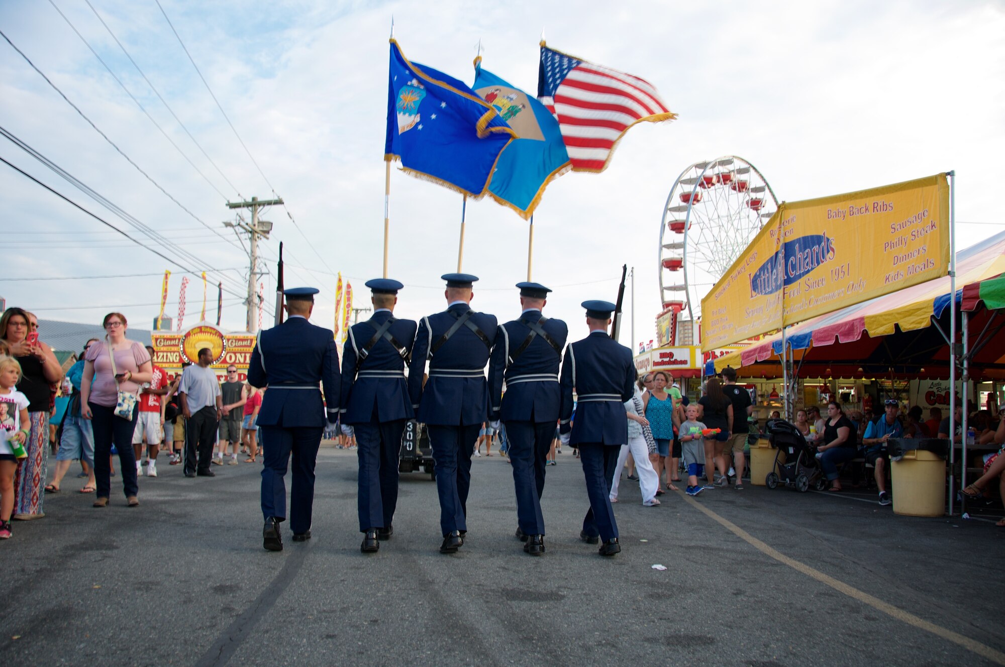 Reserve Airman from the 512th Airlift Wing join Team Dover for an Armed Forces Day parade at the Delaware State Fair, Harrington, Del., on Jul. 30, 2015. As part of Armed Forces Day, the fair recognizes veterans, service members and their families while offering free admission. (U.S. Air Force photo/2nd Lt Steve Lewis)