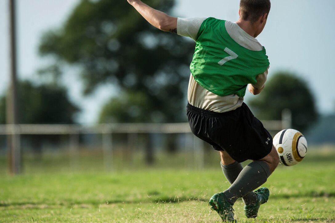 U.S. Air Force Senior Airman Shane Posey, 633rd Medical Group soccer team member, participates in the 2015 Intramural Soccer Championship game at Langley Air Force Base, Va., July 28, 2015. Players competed in front of base leadership, friends and family during the match. (U.S. Air Force photo by Senior Airman Kayla Newman/Released)