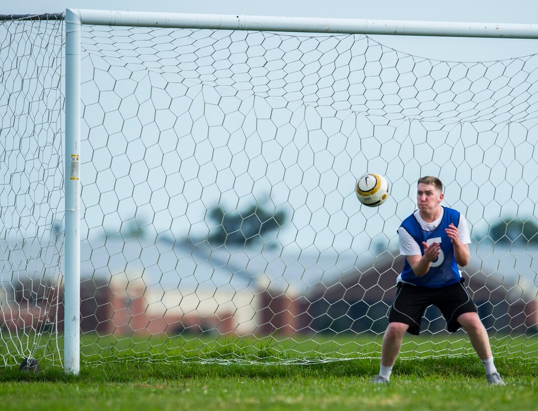 A U.S. Air Force Airman assigned to the 633rd Civil Engineer Squadron stops a shot on goal during the 2015 Intramural Soccer Championship game at Langley Air Force Base, Va., July 28, 2015. The second seeded CES was defeated by the third seeded 633rd Medical Group in the championship game. (U.S. Air Force photo by Senior Airman Kayla Newman/Released)
