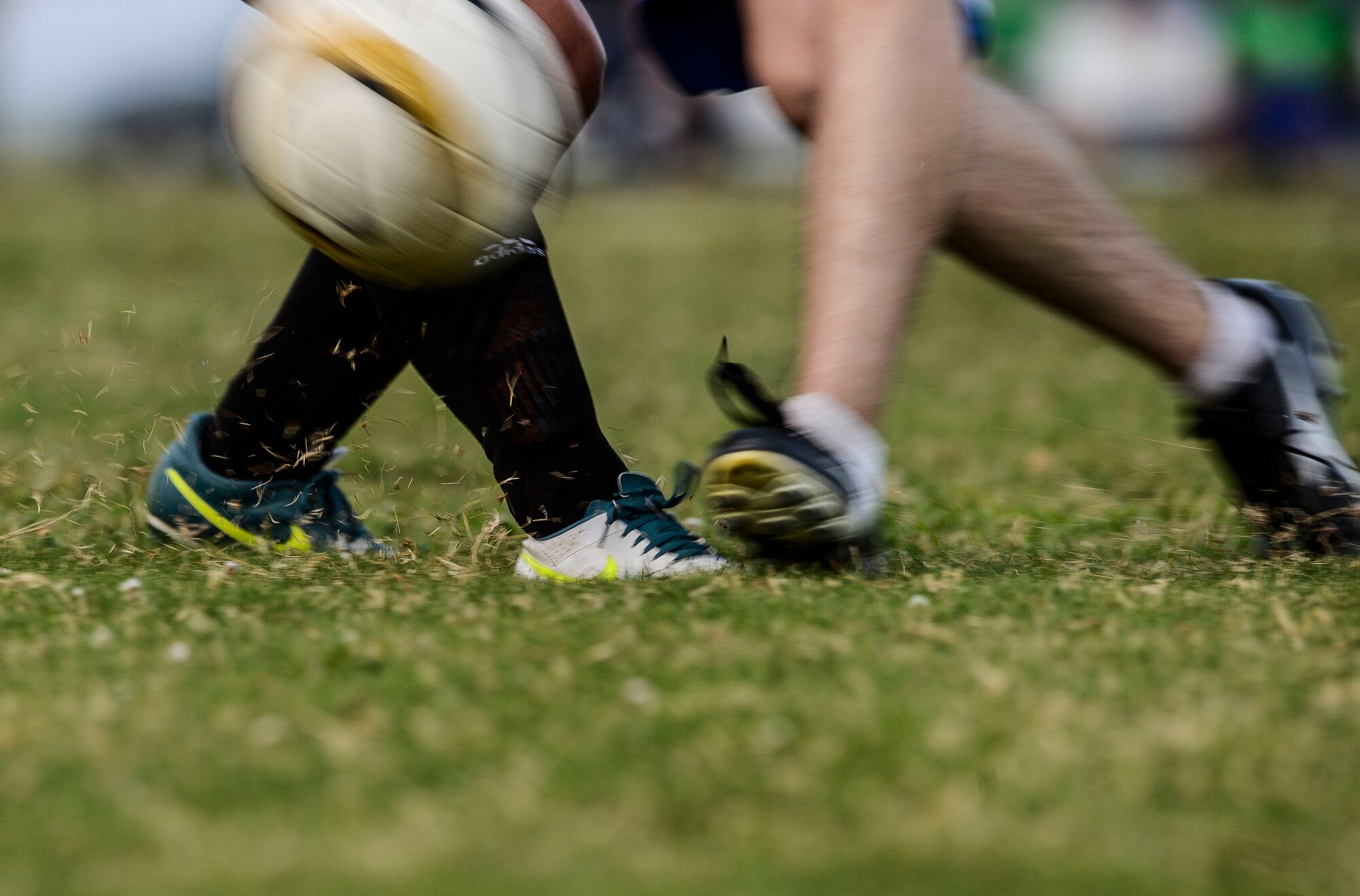 Players collide during the 2015 Intramural Soccer Championship game at Langley Air Force Base, Va., July 28, 2015. U.S. Air Force Airmen from the 633rd Medical Group and Civil Engineer Squadron competed in front of a crowd that included Col. Caroline Miller, 633rd Air Base Wing commander, and Chief Master Sgt. Mark Hurst, 633rd ABW command chief. (U.S. Air Force photo by Senior Airman Kayla Newman/Released)