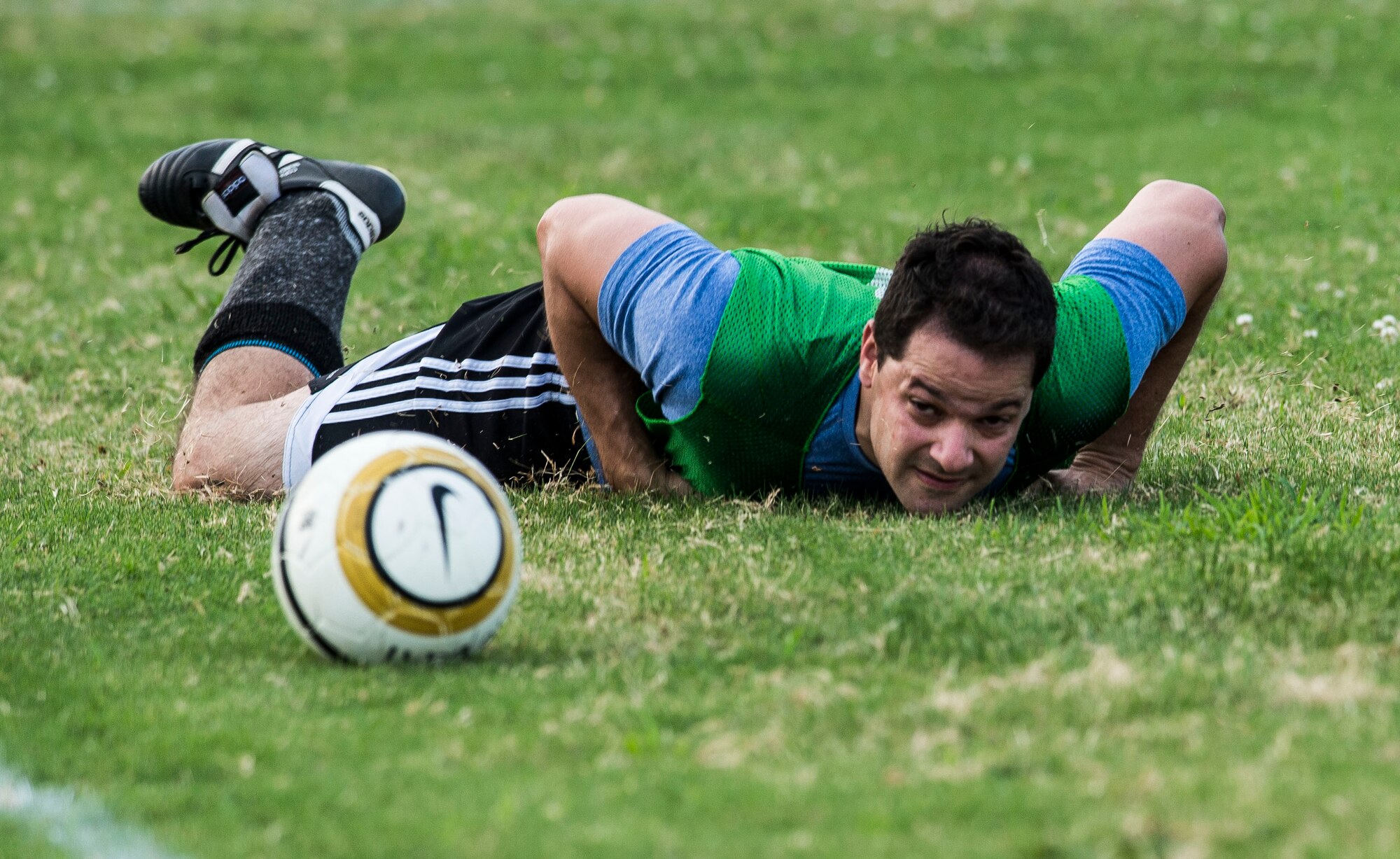 U.S. Air Force Maj. Javier Padial, 633rd Medical Group team member, dives after the ball during the 2015 Intramural Soccer Championship game at Langley Air Force Base, Va., July 28, 2015. After months of playing units from across the installation, the 633rd MDG and Civil Engineer Squadron competed for the 1st place. (U.S. Air Force photo by Senior Airman Kayla Newman/Released)
