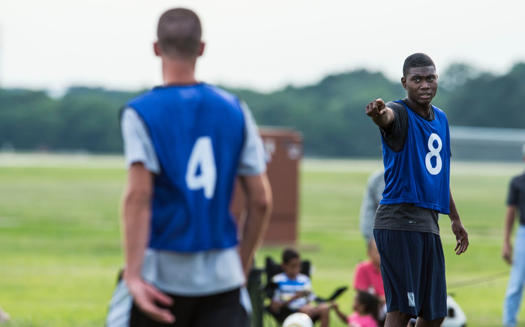 U.S. Air Force Airmen assigned to the 633rd Civil Engineer Squadron, participate in the 2015 Intramural Soccer Championship game at Langley Air Force Base, Va., July 28, 2015. After two games, 633rd Medical Group won the trophy.  (U.S. Air Force photo by Senior Airman Kayla Newman/Released)