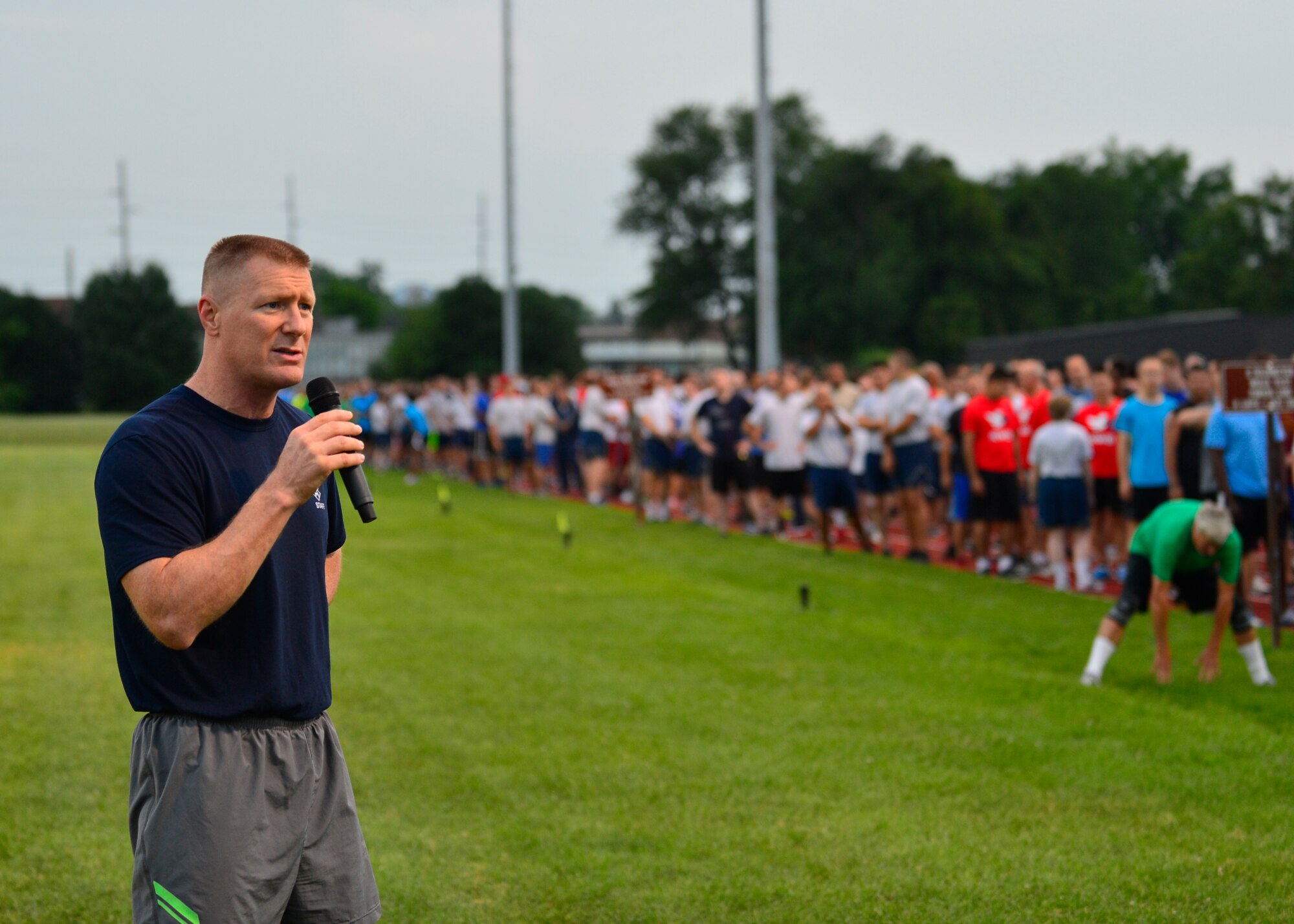 Col. Michael Grismer, 436th Airlift Wing commander, speaks at the 5K Warrior Run July 30, 2015, at the track on Dover Air Force Base, Del. The run marked the grand opening of the new base track with a plexitrac accelerator surface. (U.S. Air Force photo/Airman 1st Class William Johnson)