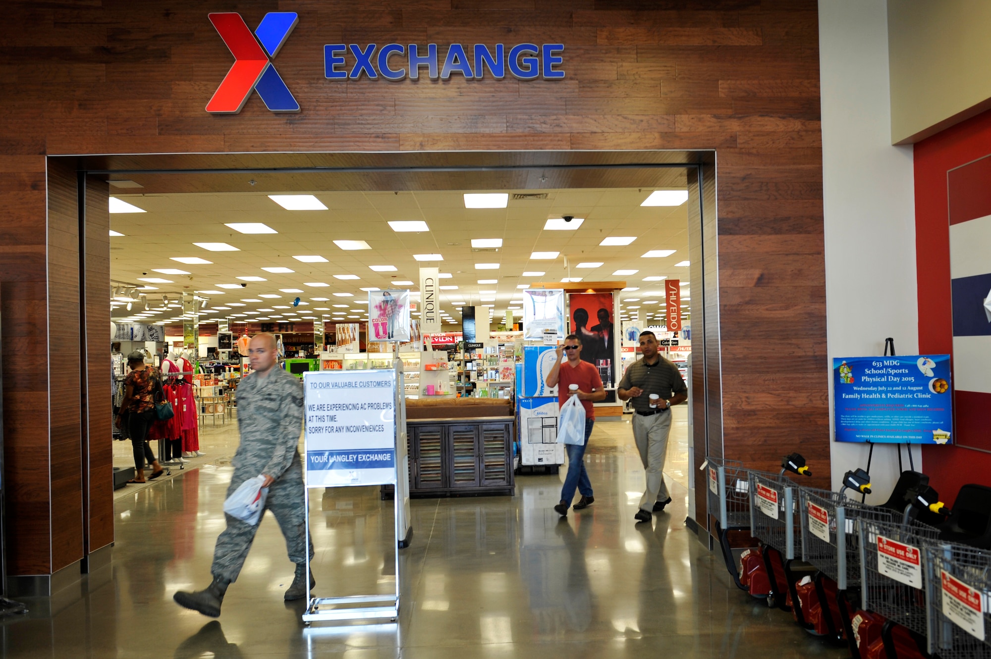 U.S. Service members and shoppers exit the Base Exchange at Langley Air Force Base, Va., July 28, 2015. Since March 2014, the Exchange has undergone numerous constructional upgrades, such as an expanded floor plan, raised ceilings and more food and shopping options. (U.S. Air Force photo by Senior Airman Jordan Garner)