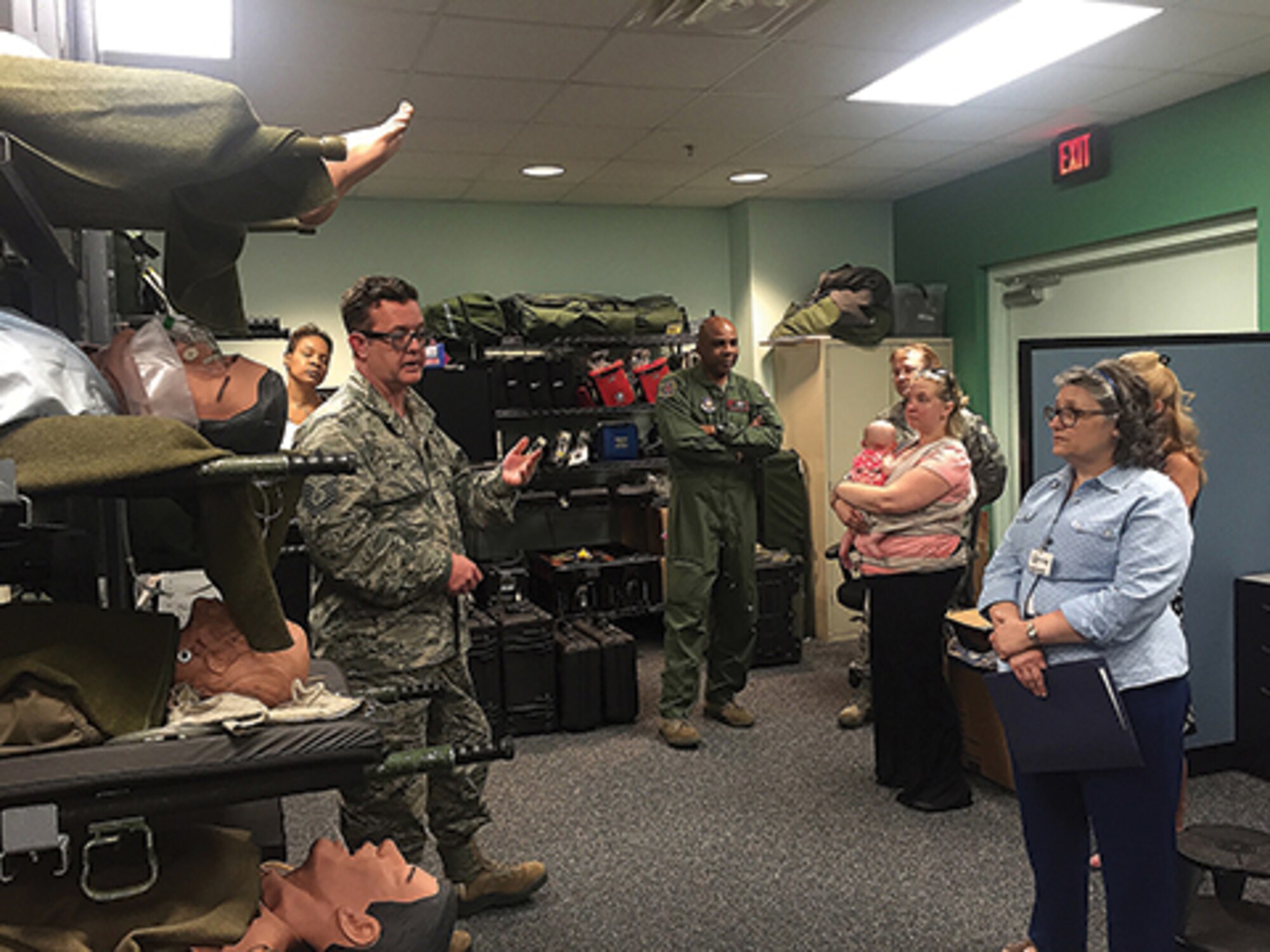 Chief Master Sgt. Patrick Weir of the 908th Aeromedical Evacuation Squadron explains squadron missions and operations to visiting members of the 908th Key Spouse organization. 
