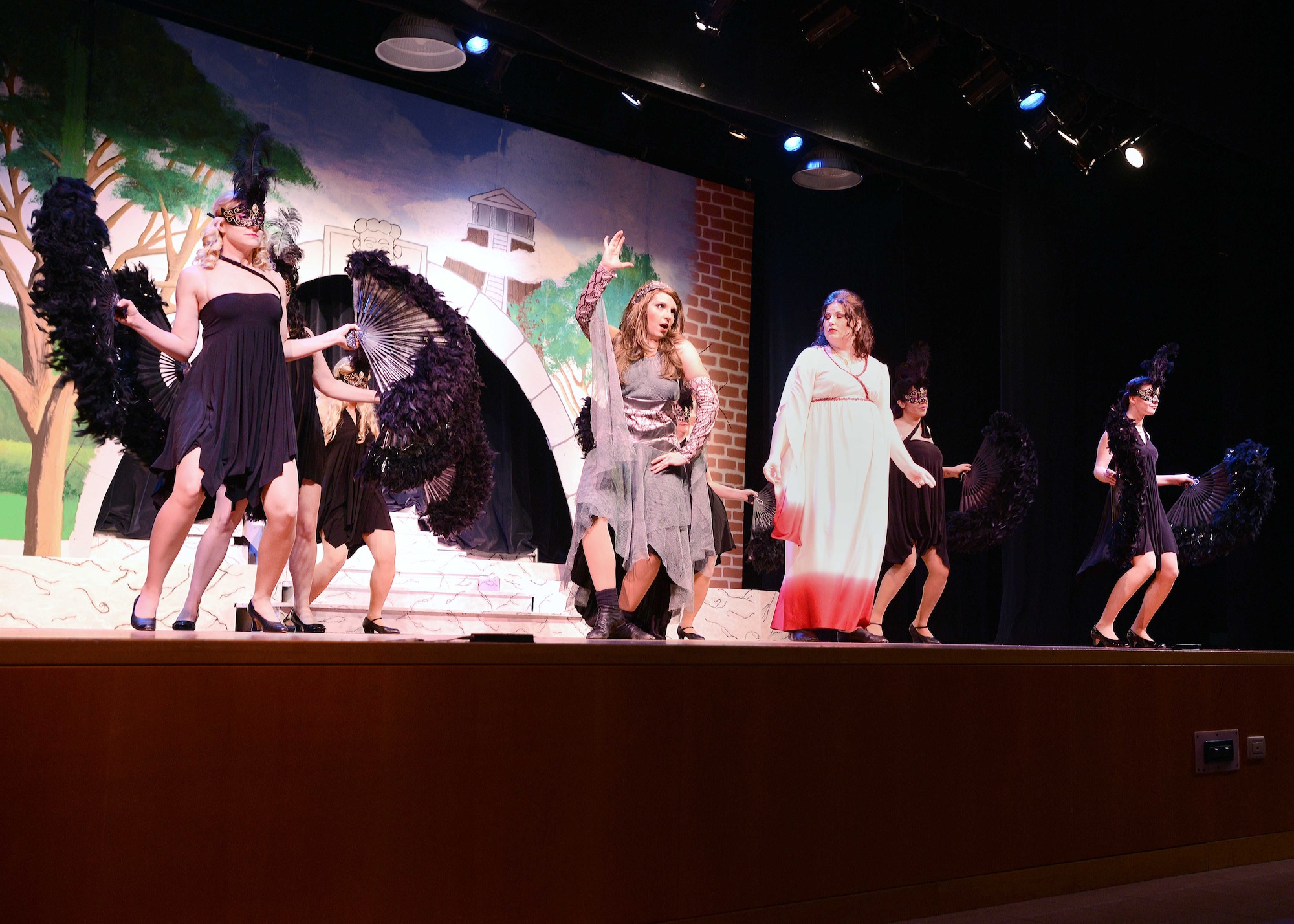 The cast of the Aviano Community Theater performance, “Xanadu,” dance during an act, March 15, 2014, at Aviano Air Base, Italy. The Aviano Community Theatre offers Team Aviano members the opportunity to explore theater by allowing participants participate in roles, such as acting and set design. (U.S. Air Force photo/Airman 1st Class Deana Heitzman)