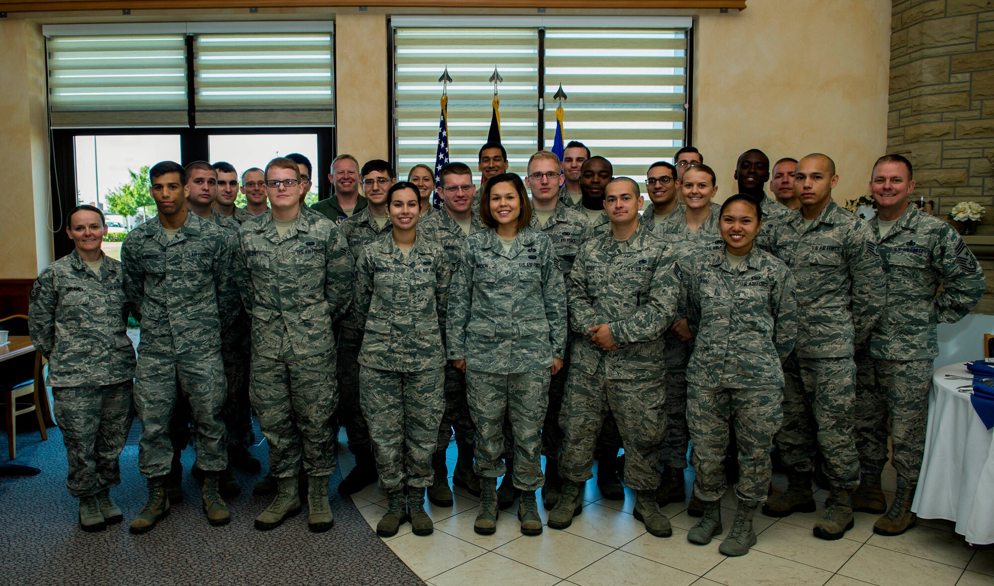 Recipients of the Diamond Sharp Award pose for a group photo during the Diamond Sharp Airmen Appreciation Breakfast in Club Eifel on Spangdahlem Air Base, Germany, July 30, 2015. The Spangdahlem First Sergeants Council sponsors the quarterly program to recognize deserving Airmen for their commitment for professionalism, job performance and selfless service. (U.S. Air Force photo by Airman 1st Class Timothy Kim/Released)