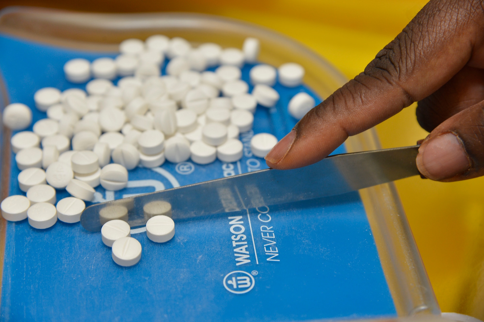 Jessica Riley, 6th Medical Support Squadron pharmacy technician, counts pills for a prescription refill at the PharmaCARE Center on MacDill Air Force Base, Fla., July 29, 2015. The PharmaCARE Center provides outpatient pharmaceutical care to all beneficiary categories at MacDill. (U.S. Air Force photo by Staff Sgt. Shandresha Mitchell/Released)