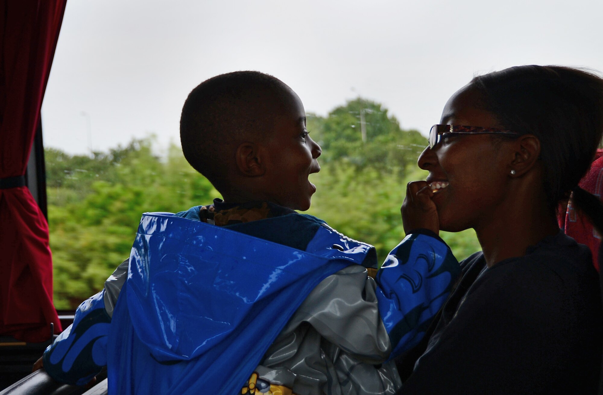 Star Copeland, wife of Tech Sgt. Jason Copeland, 48th Logistics Readiness Squadron quality assurance evaluator, sits with her son, Kincaid, on a bus to Warwick Castle, England, July 24, 2015. The Comprehensive Airman Fitness program and the 48th Fighter Wing Chaplain Corps hosted a deployed spouses trip that provided spouses with the opportunity to engage with other families and explore the local community. (U.S. Air Force photo by Senior Airman Erin O’Shea/Released) 
