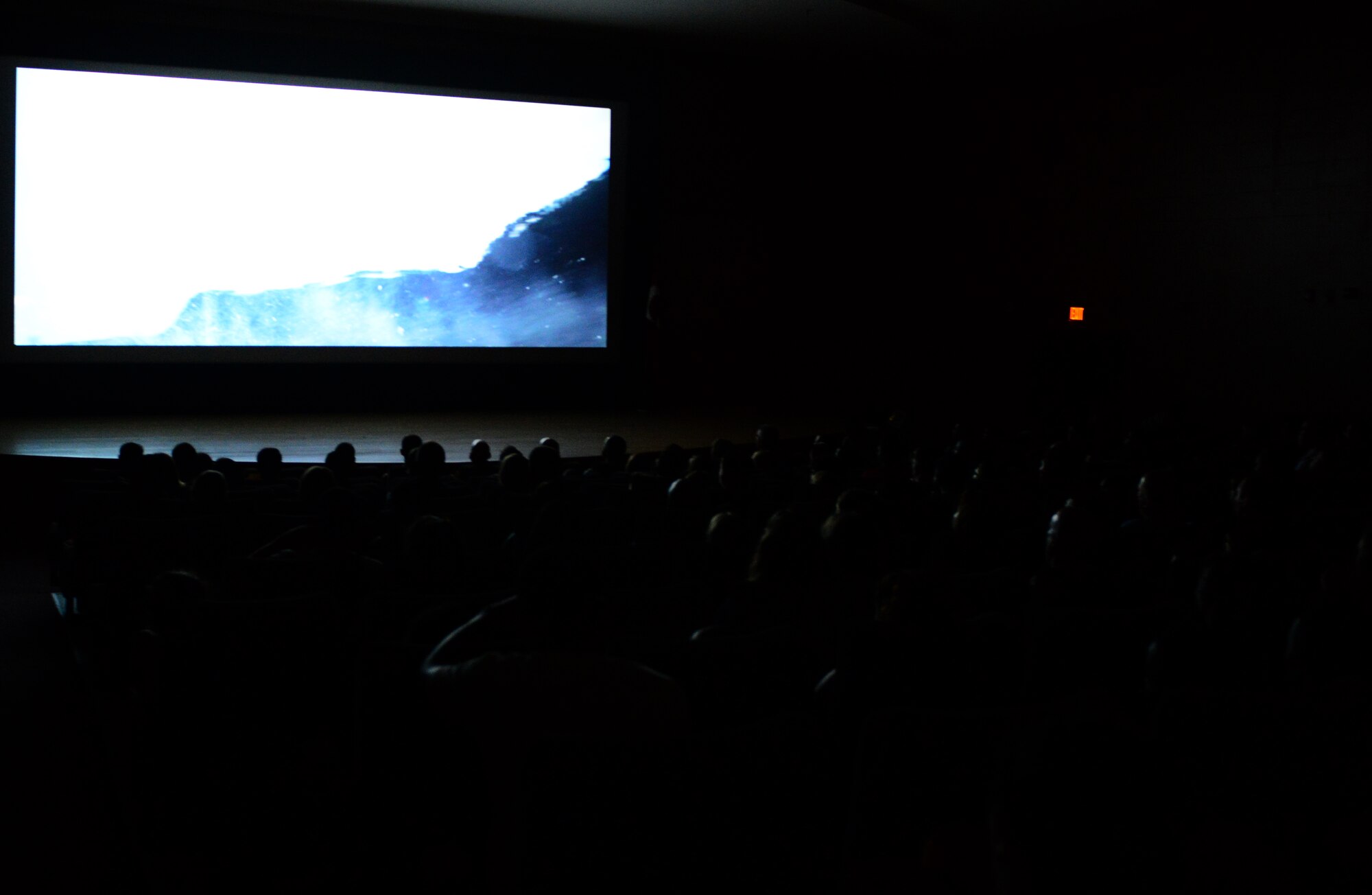 U.S. and Turkish personnel watch a movie at the new base community center July 29, 2015, at Incirlik Air Base, Turkey. The community center had a soft opening ceremony and will officially open in the next 30 days. (U.S. Air Force photo by Staff Sgt. Caleb Pierce/Released) 