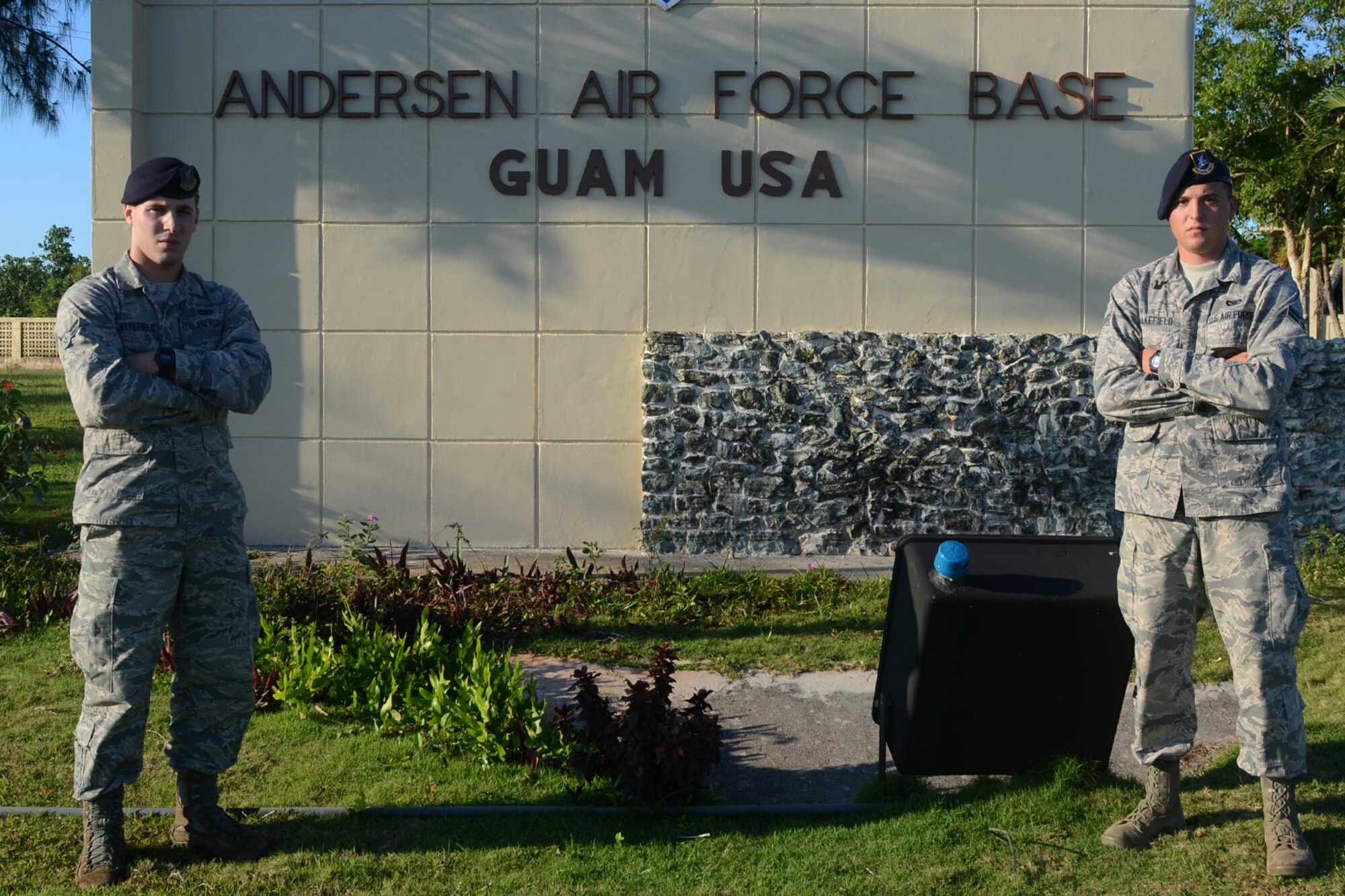 Airmen 1st Class Colby (left) and Travis Wakefield, 36th Security Forces Squadron entry controllers, stand at the entry to Andersen Air Force Base, Guam, July 29, 2015. While they are brothers in arms who serve together, they are also fraternal twins who have worked together since entering the Air Force in October 2013. (U.S. Air Force photo by Airman 1st Class Alexa Ann Henderson/Released)