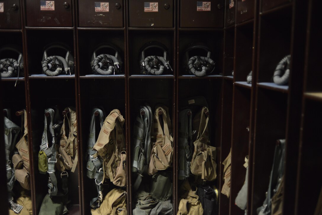 Helmets, harness and masks of B-1 Bomber aircrews sit in their lockers after 379th Expeditionary Operations Support Squadron Aircrew Flight Equipment airmen completed their daily maintenance and inspections July 29, 2015 at Al Udeid Air Base, Qatar. B-1 Bomber aircrews rely on AFE airmen’s proficiency to ensure proper function of helmets, life preservers, communication modules and other types of equipment used during flight or in case of an emergency. (U.S. Air Force photo/Staff Sgt. Alexandre Montes)