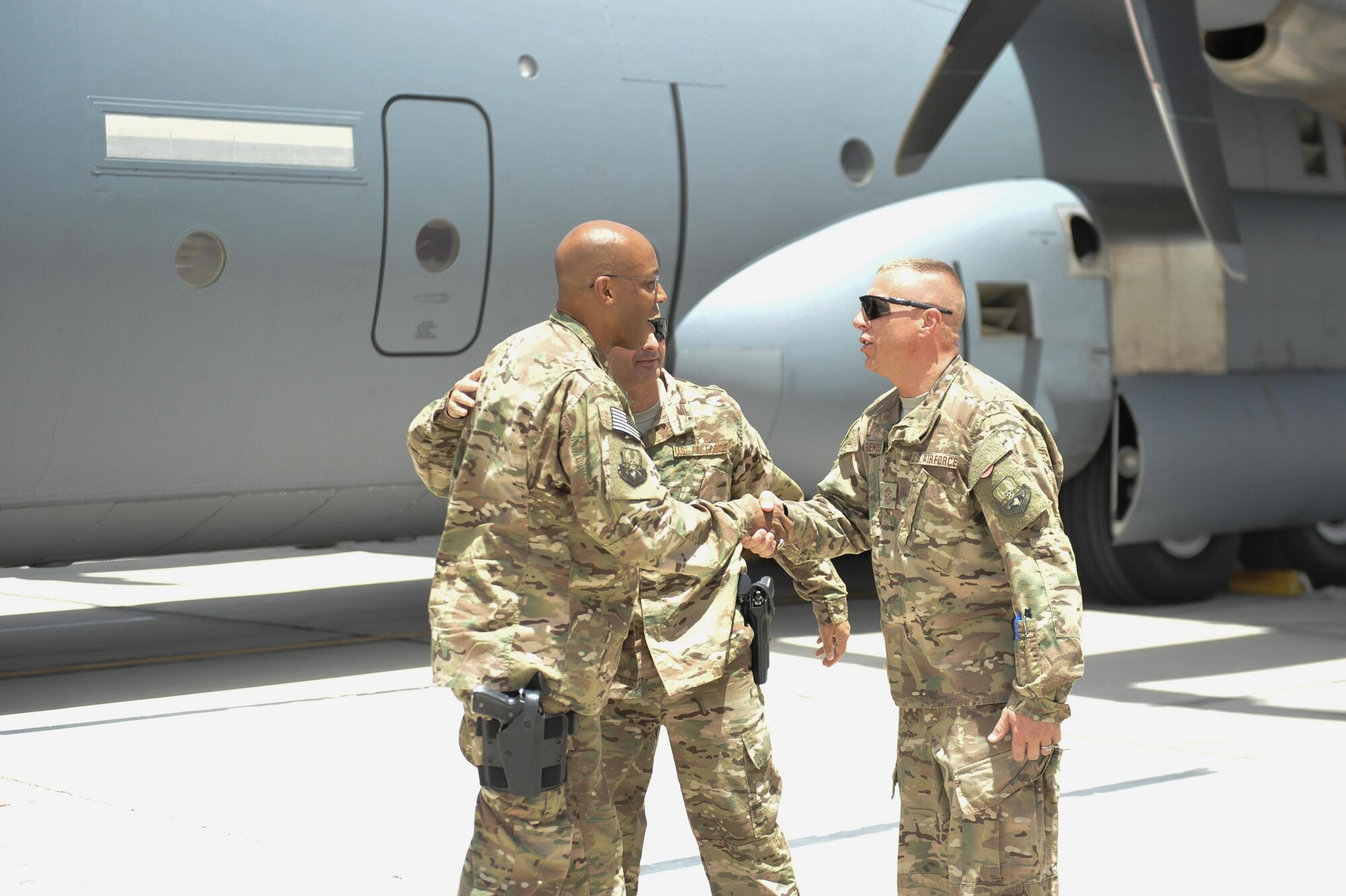 U.S. Air Force Lt. Gen. Charles Q. Brown Jr., U.S. Air Forces Central Command commander, greets Chief Master Sgt. Matt Grengs, 455th Air Expeditionary Wing command chief, at Kandahar Airfield, Afghanistan, July 25, 2015. Brown met with Airmen from Bagram Airfield and KAF during his tour of Afghanistan and got a first-hand look at how Airmen support the mission in Afghanistan. (U.S. Air Force photo by Maj. Tony Wickman/Released)