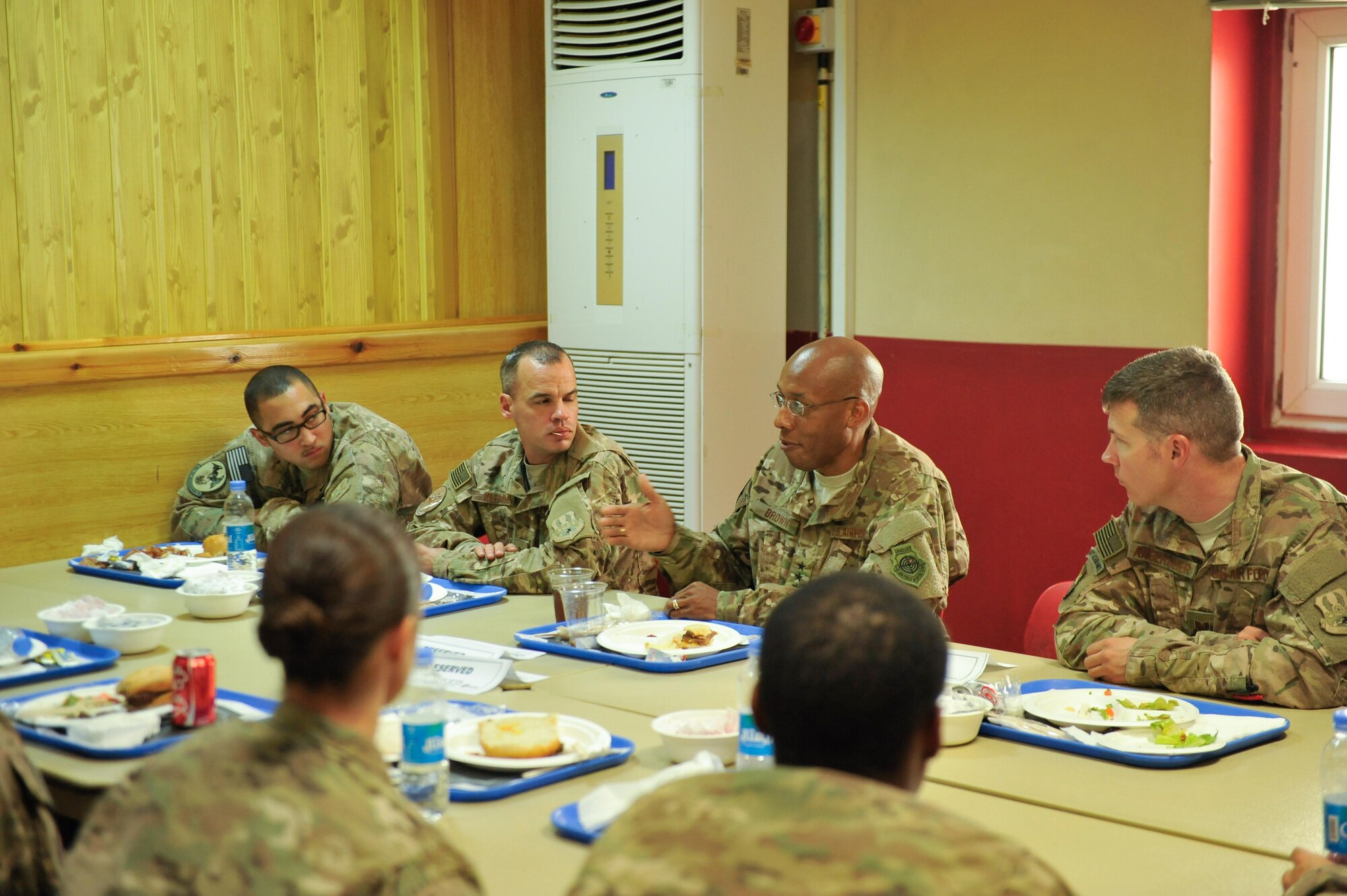 U.S. Air Force Lt. Gen. Charles Q. Brown Jr., U.S. Air Forces Central Command commander, talks with Airmen assigned to the 451st Air Expeditionary Group at Kandahar Airfield, Afghanistan, July 25, 2015. Brown met with Airmen from Bagram Airfield and KAF during his tour of Afghanistan and got a first-hand look at how Airmen support the mission in Afghanistan. (U.S. Air Force photo by Maj. Tony Wickman/Released)