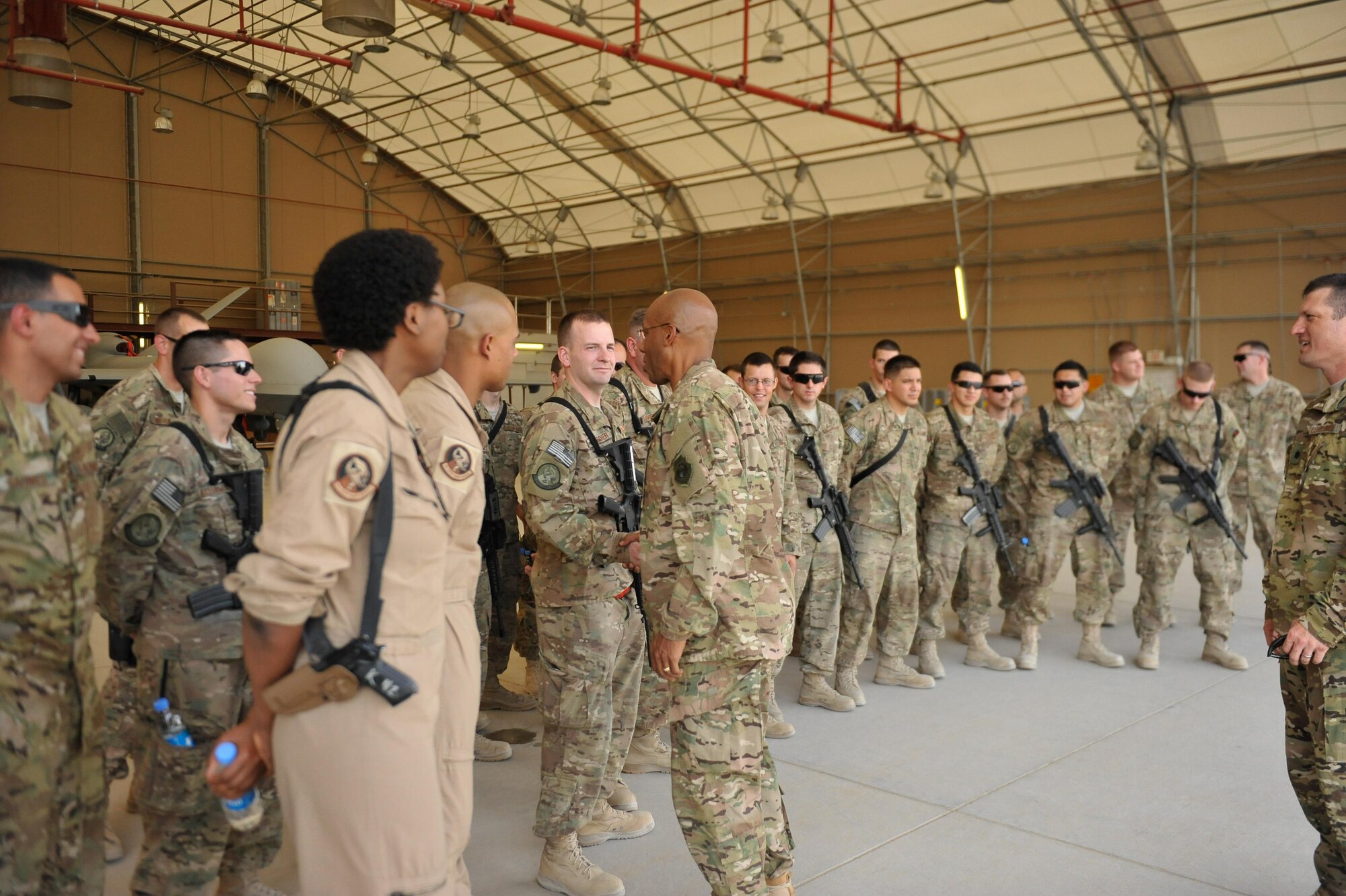 U.S. Air Force Lt. Gen. Charles Q. Brown Jr., U.S. Air Forces Central Command commander, greets Airmen assigned to the 62nd Expeditionary Reconnaissance Squadron at Kandahar Airfield, Afghanistan, July 25, 2015. Brown met with Airmen from Bagram Airfield and KAF during his tour of Afghanistan and got a first-hand look at how Airmen support the mission in Afghanistan. (U.S. Air Force photo by Maj. Tony Wickman/Released)