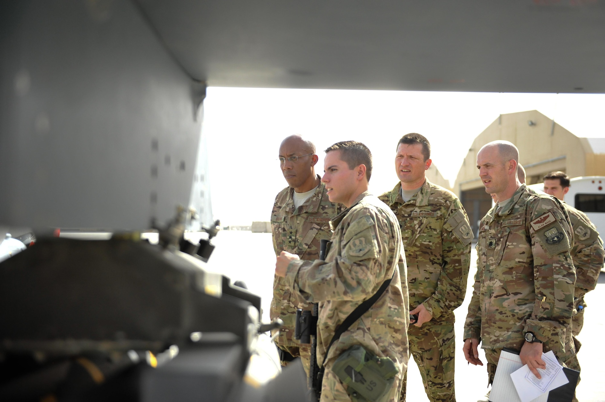 U.S. Air Force Staff Sgt. Samuel Williams, 62nd Expeditionary Reconnaissance Squadron, briefs Lt. Gen. Charles Q. Brown Jr., U.S. Air Forces Central Command commander, on the munitions capabilities of an MQ-9 Reaper aircraft at Kandahar Airfield, Afghanistan, July 25, 2015. Brown met with Airmen from Bagram Airfield and KAF during his tour of Afghanistan and got a first-hand look at how Airmen support the mission in Afghanistan. (U.S. Air Force photo by Maj. Tony Wickman/Released)