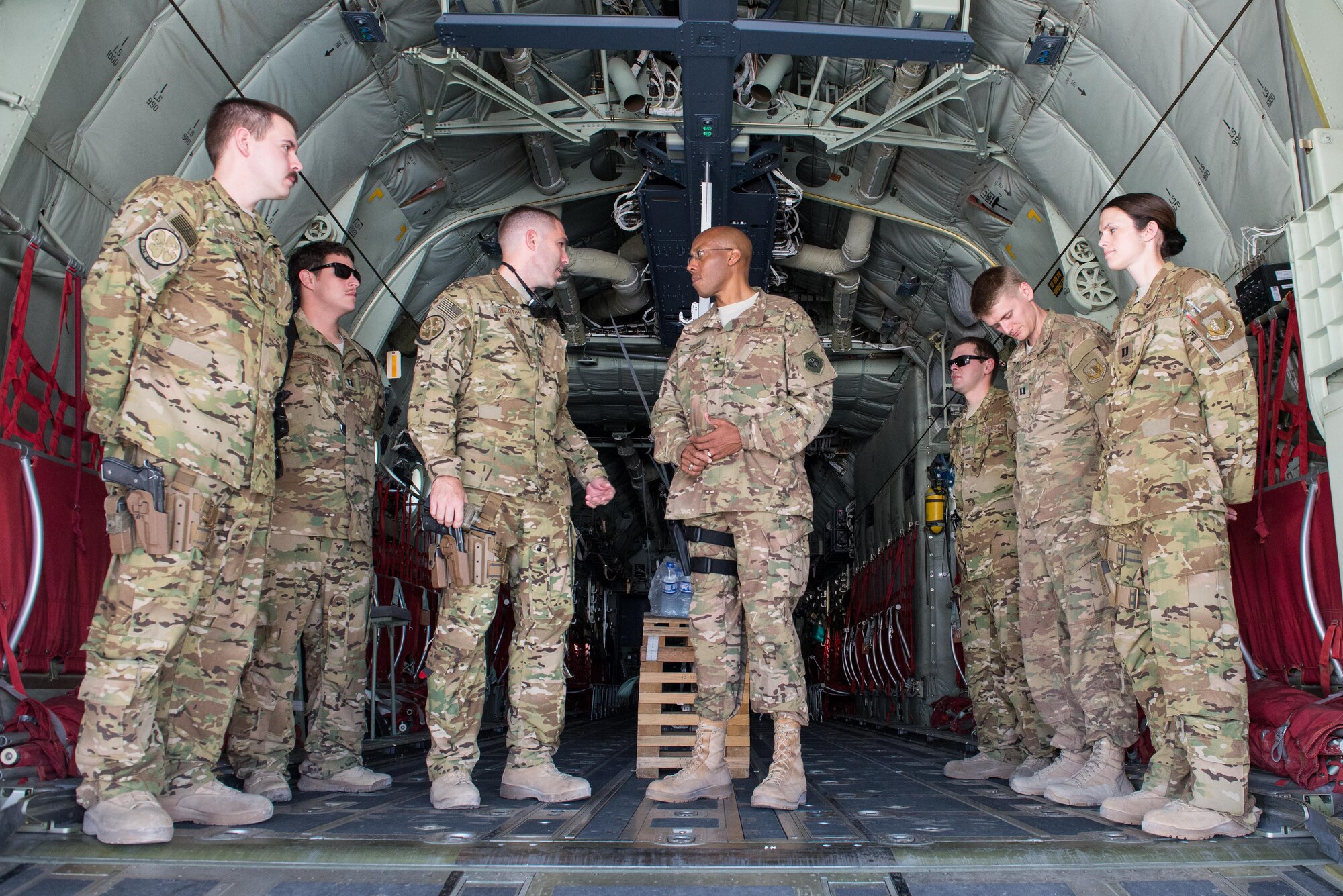 U.S. Air Force Lt. Gen. Charles Q. Brown Jr., U.S. Air Forces Central Command commander, talks with Airmen assigned to the 774th Expeditionary Airlift Squadron at Bagram Airfield, Afghanistan, July 25, 2015. Brown met with Airmen from BAF and Kandahar Airfield during his tour of Afghanistan and got a first-hand look at how Airmen support the mission in Afghanistan. (U.S. Air Force photo by Tech. Sgt. Joseph Swafford/Released)
