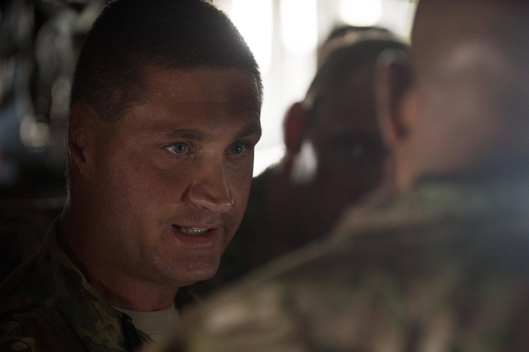 U.S. Air Force Tech. Sgt. Russell McLamb, 455th Expeditionary Aeromedical Evacuation Squadron, explains the AE mission to Lt. Gen. Charles Q. Brown Jr., U.S. Air Forces Central Command commander, at Bagram Airfield, Afghanistan, July 25, 2015. Brown met with Airmen from BAF and Kandahar Airfield during his tour of Afghanistan and got a first-hand look at how Airmen support the mission in Afghanistan. (U.S. Air Force photo by Tech. Sgt. Joseph Swafford/Released)