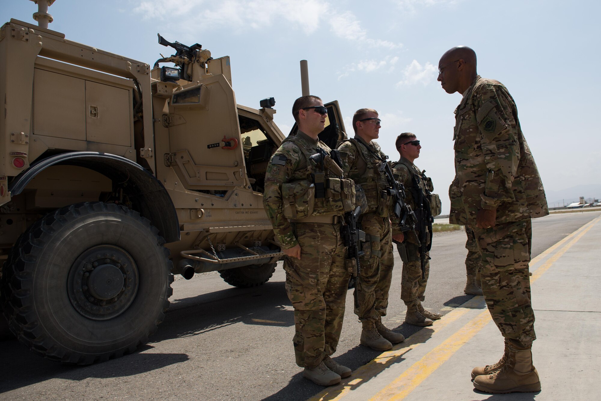 U.S. Air Force Lt. Gen. Charles Q. Brown Jr., U.S. Air Forces Central Command commander, talks with Airmen assigned to the 455th Expeditionary Security Forces Squadron at Bagram Airfield, Afghanistan, July 25, 2015. Brown met with Airmen from BAF and Kandahar Airfield during his tour of Afghanistan and got a first-hand look at how Airmen support the mission in Afghanistan. (U.S. Air Force photo by Tech. Sgt. Joseph Swafford/Released)