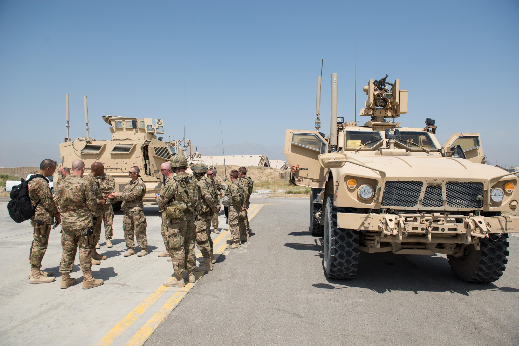 U.S. Air Force Lt. Gen. Charles Q. Brown Jr., U.S. Air Forces Central Command commander, talks with Airmen assigned to the 455th Expeditionary Security Forces Squadron at Bagram Airfield, Afghanistan, July 25, 2015. Brown met with Airmen from BAF and Kandahar Airfield during his tour of Afghanistan and got a first-hand look at how Airmen support the mission in Afghanistan. (U.S. Air Force photo by Tech. Sgt. Joseph Swafford/Released)