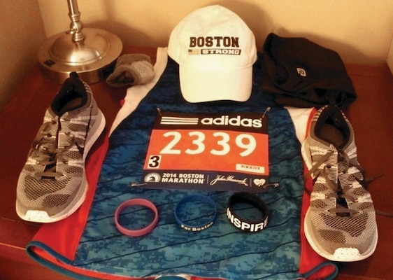 A tradition for runners to ensure they have everything they need for the day of their race, is to set out their gear the night before. The wrist bands help motivate during a run. "For Boston" bands like the one in the middle were sold to raise funds for the victims of the 2013 bombing. The "INSPIRE" band is a gift from his friend Maria who is among those who inspired him to run the Boston Marathon and the purple band has the word "Hope" inscribed on it. Chamberlain wore the purple band at the request of his brother's wife, Irene, for his brother and coworkers whose spouses were battling cancer.