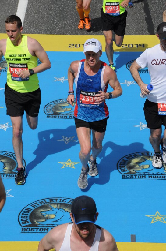 At about the midway point of the 2014 Boston Marathon. Chamberlain finished the Boston Marathon, having run not 26.2 miles but 26.43 with a time of 3:01:01. 