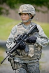 Master Sgt. Maria Victoria R. Quitugua, a security forces craftsman assigned to the 254th Security Forces Squadron, Guam Air National Guard, stands near a trail at Joint Base Andrews, Maryland, June 10, 2015. Quitugua is the 2015 Air National Guard Outstanding Senior NCO of the Year. 