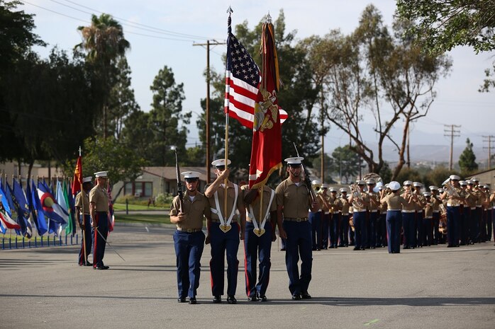 The national colors are posted during the relinquishment of command ceremony for the 1st Marine Division aboard Marine Corps Base Camp Pendleton, Calif., July 30, 2015. Major Gen. Lawrence D. Nicholson passed his role and responsibilities as the commanding general to Brig. Gen. Daniel D. Yoo.