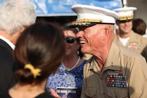 Major Gen. Lawrence D. Nicholson speaks with guests after relinquishing his role as the commanding general of the 1st Marine Division to Brig. Gen. Daniel D. Yoo aboard Marine Corps Base Camp Pendleton, Calif., July 30, 2015. Yoo most recently served as the assistant division commander for 1st Marine Division.