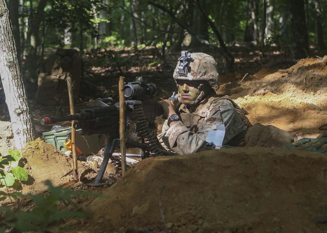 A Marine with Support Company, 2nd Combat Engineer Battalion, scans the treeline for enemy combatants from his fighting hole during a force-on-force defensive operations exercise aboard Fort A.P. Hill, Virginia, July 30, 2015. The force-on-force exercise was the first part of a three-week-long deployment for training where the battalion will enhance the Marines’ knowledge of their combat engineer skills in a unique training environment to prepare them for upcoming deployments. (U.S. Marine Corps photo by Cpl. Michelle Reif/Released)