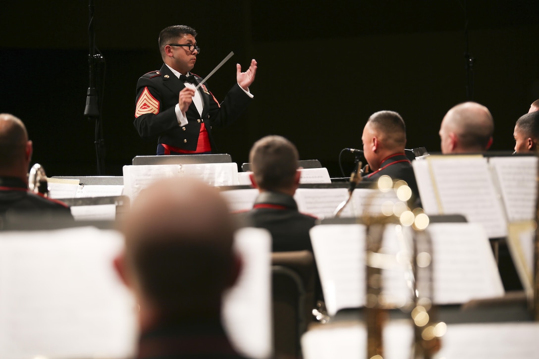 Bandmaster Master Sgt. William Call conducts during a performance by the Marine Corps Band New Orleans at Foothills Alliance Church in Calgary, AB, May 2, 2015. The MCBNOLA conducted their spring tour through Canada and the northern United States April 29 – May 11, 2015. The tour included combined concerts with the Royal Canadian Navy Reserve Band HMCS Tecumseh, as well as the University of Montana wind ensemble. The tour held concerts in Calgary, Missoula, Mt.; Billings, Mt.; Rapid City, SD and Cheyenne, Wy. (U.S. Marine Corps photo by Cpl. Tiffany Edwards)