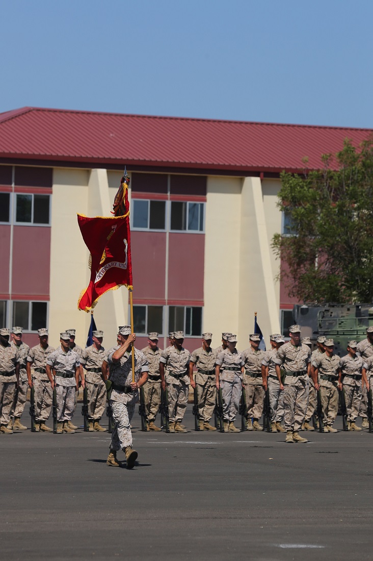 U.S. Marine Corps SgtMaj. Keith Massi carries the Marine Corps colors to the reviewing area during a change of command ceremony aboard Camp Pendleton, Calif., July 17. U.S. Marine Corps Col. Matthew G. Trollinger relinquished his command of the 11th MEU to Col. Clay C. Tipton. (U.S. Marine Corps photo by Cpl. Jonathan R. Waldman/Released)