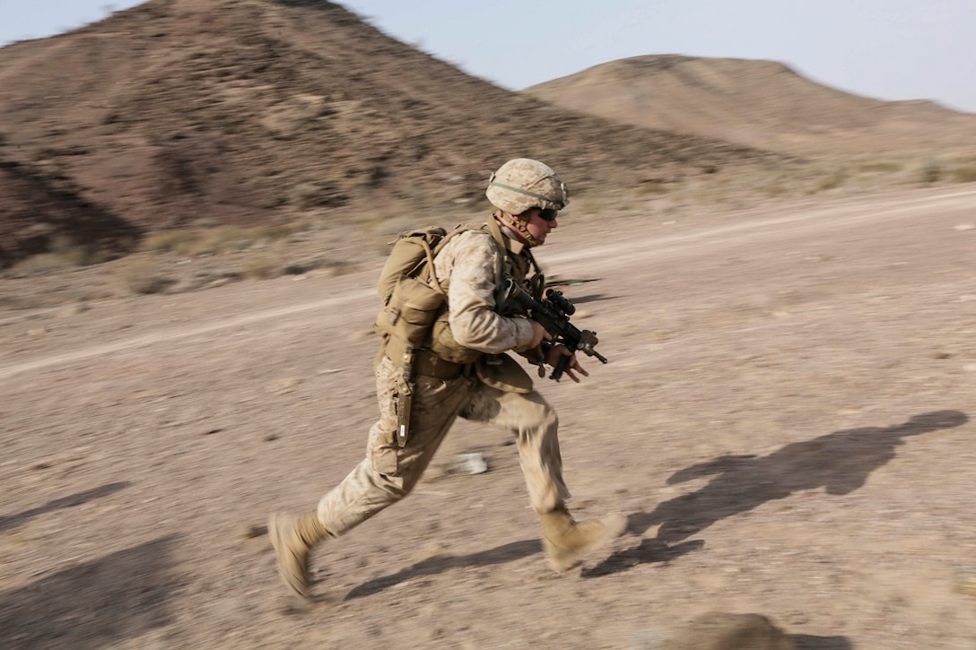 ARTA BEACH, Djibouti (July 22, 2015) A U.S. Marine with Battalion Landing Team 3rd Battalion, 1st Marine Regiment, 15th Marine Expeditionary Unit runs to his throwing position during a grenade accuracy exercise.  Elements of the 15th Marine Expeditionary Unit are ashore in Djibouti for sustainment training to maintain and enhance the skills they developed during their pre-deployment training period.  The 15th MEU is currently deployed in support of maritime security operations and theater security cooperation efforts in the U.S. 5th and 6th Fleet areas of operation. (U.S. Marine Corps photo by Sgt. Jamean Berry/Released)