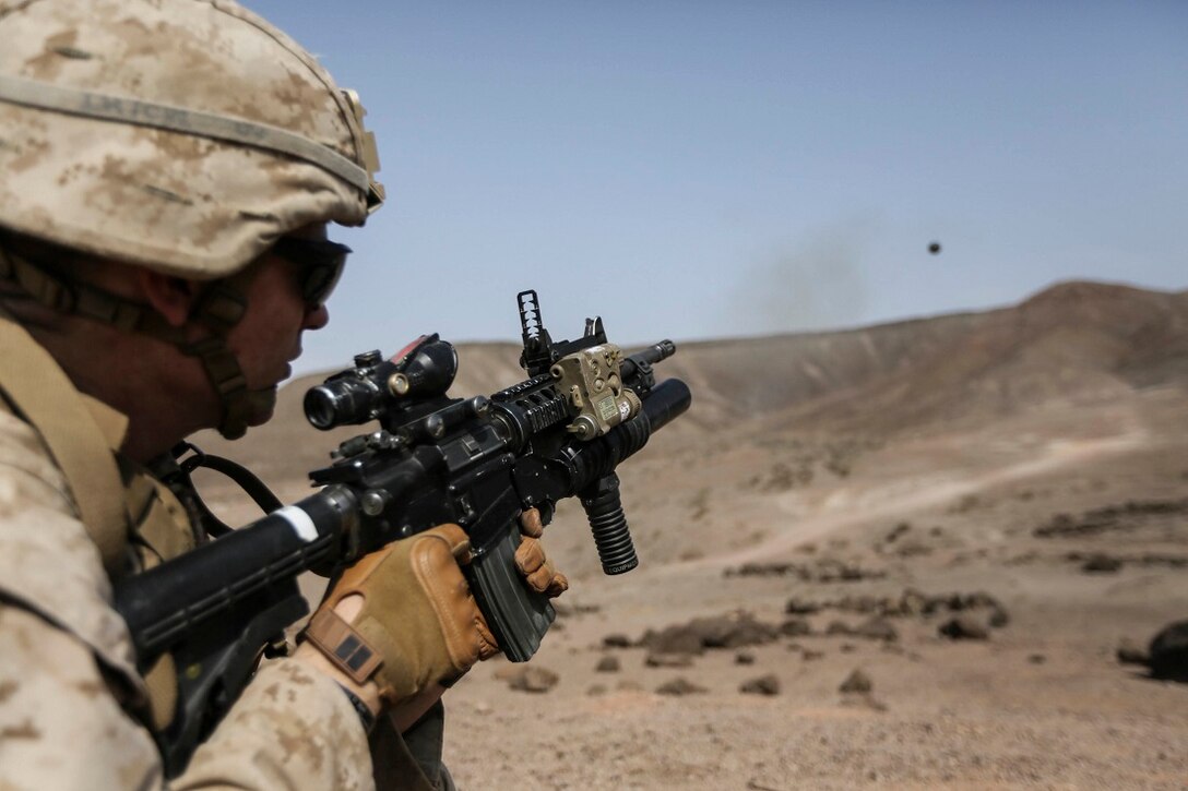 ARTA BEACH, Djibouti (July 22, 2015) U.S. Marine Lance Cpl. Brandon Kalz fires an M203 grenade launcher during a grenade accuracy exercise.  Kalz is a team leader with Battalion Landing Team 3rd Battalion, 1st Marine Regiment, 15th Marine Expeditionary Unit. Elements of the 15th Marine Expeditionary Unit are ashore in Djibouti for sustainment training to maintain and enhance the skills they developed during their pre-deployment training period.  The 15th MEU is currently deployed in support of maritime security operations and theater security cooperation efforts in the U.S. 5th and 6th Fleet areas of operation. (U.S. Marine Corps photo by Sgt. Jamean Berry/Released)