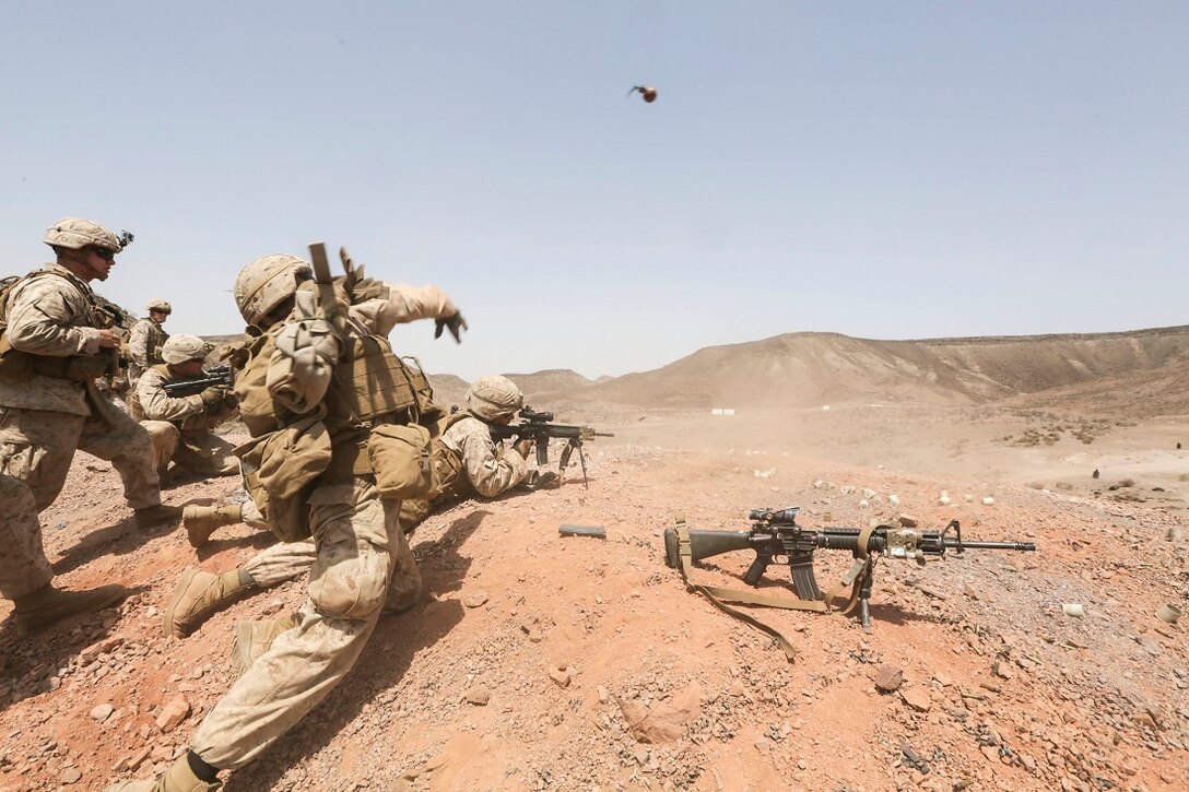 ARTA BEACH, Djibouti (July 22, 2015) A U.S. Marine with Battalion Landing Team 3rd Battalion, 1st Marine Regiment, 15th Marine Expeditionary Unit throws a practice grenade during a grenade accuracy exercise.  Elements of the 15th Marine Expeditionary Unit are ashore in Djibouti for sustainment training to maintain and enhance the skills they developed during their pre-deployment training period.  The 15th MEU is currently deployed in support of maritime security operations and theater security cooperation efforts in the U.S. 5th and 6th Fleet areas of operation. (U.S. Marine Corps photo by Sgt. Jamean Berry/Released)