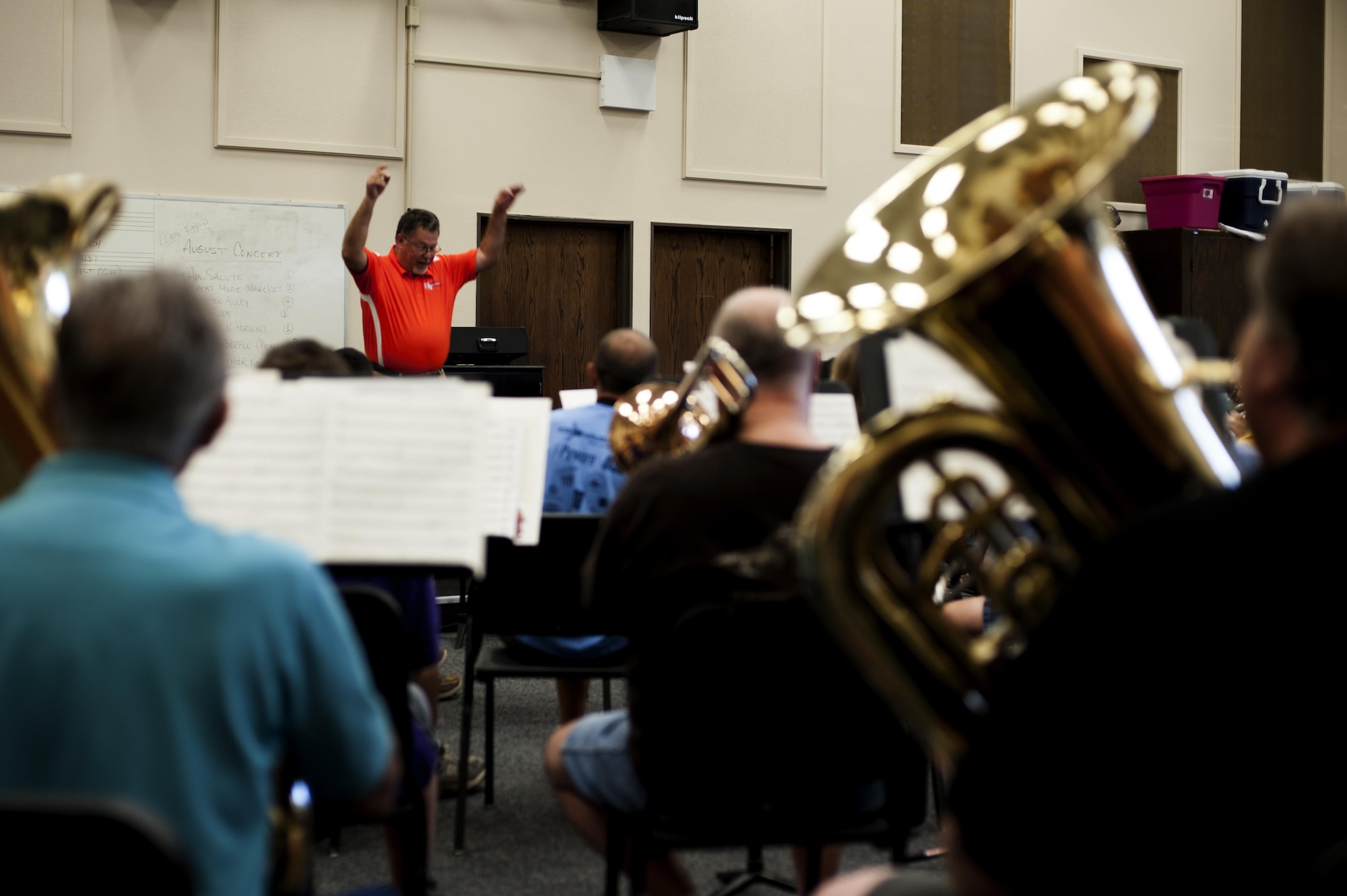 Dr. David Phillips, Central High School band director, conducts the San Angelo Community Band during band practice in the band hall at Angelo State University, San Angelo, Texas, July 28, 2015. The band meets to practice every Tuesday for weeks leading up to their events. (U.S. Air Force photo by Scott Jackson/Released)