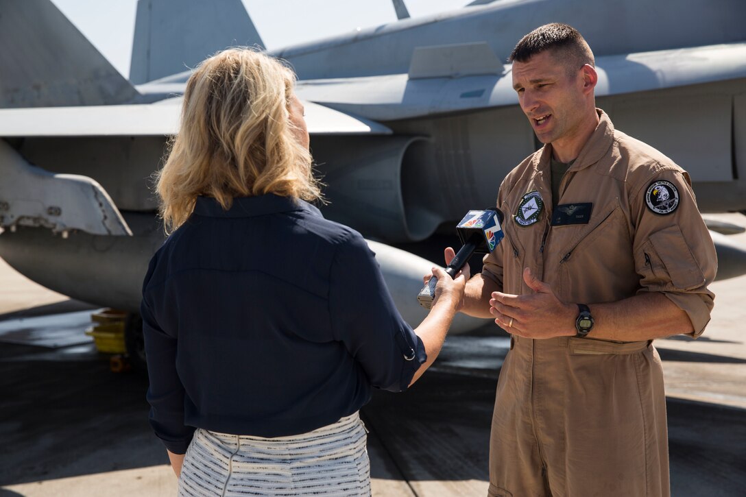 Bridget Naso, a military reporter with NBC 7 San Diego, interviews Maj. Jayson Tiger, operations officer with Marine Fighter Attack Training Squadron (VMFAT) 101, during the Marine Corps Air Station Miramar Media Day aboard MCAS Miramar, California, July 29. The MCAS Miramar Media Day allowed the media an opportunity to delve deeper into the moving parts that make the air station and the Marine Corps work. (U.S. Marine Corps photo by Cpl. Alissa P. Schuning/Released)