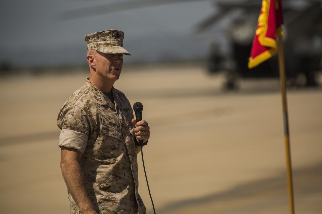 Col. Chad Blair, commanding officer of Marine Aircraft Group (MAG) 16, speaks to Marines and guests during the MAG-16 change of command ceremony aboard Marine Corps Air Station Miramar, California, July 30. Blair received the command from Col. Anthony Bianca, who will work as the Director of Expeditionary Warfare for the Chief of Naval Operations at the Pentagon. (U.S. Marine Corps photo by Sgt. Brian Marion/Released)