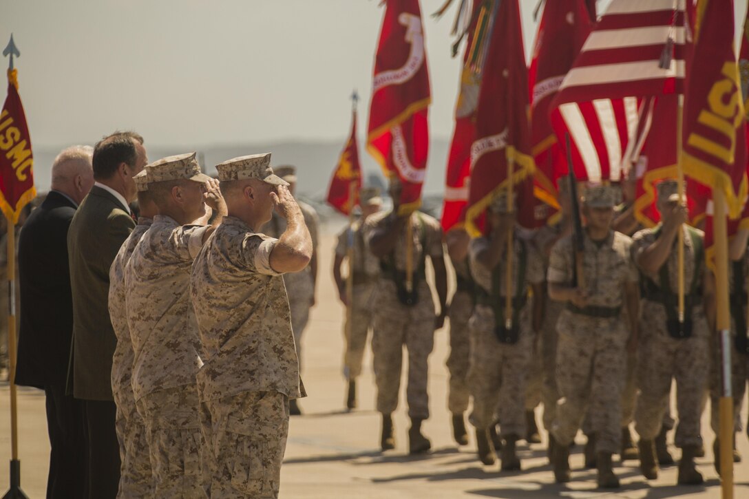 Col. Chad Blair, commanding officer of Marine Aircraft Group (MAG) 16, and past commanding officers of MAG-16, salute Marines marching in formation during the MAG-16 change of command ceremony aboard Marine Corps Air Station Miramar, California, July 30. Blair received the command from Col. Anthony Bianca, who will work as the Director of Expeditionary Warfare for the Chief of Naval Operations at the Pentagon. (U.S. Marine Corps photo by Sgt. Brian Marion/Released)