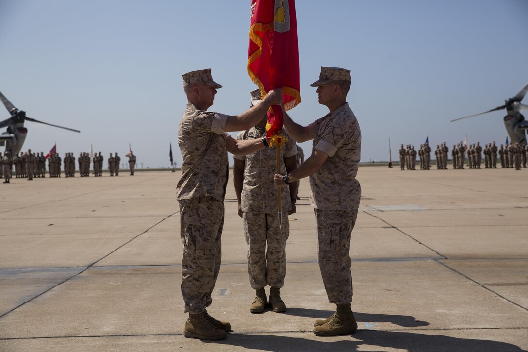 Col. Chad Blair, commanding officer of Marine Aircraft Group (MAG) 16, left, receives the MAG-16 battle standard from Col. Anthony Bianca, former commanding officer of MAG-16, during the MAG-16 change of command ceremony aboard Marine Corps Air Station Miramar, California, July 30. The passing of the flag signified the passing of command from Bianca to Blair. (U.S. Marine Corps photo by Sgt. Brian Marion/Released)
